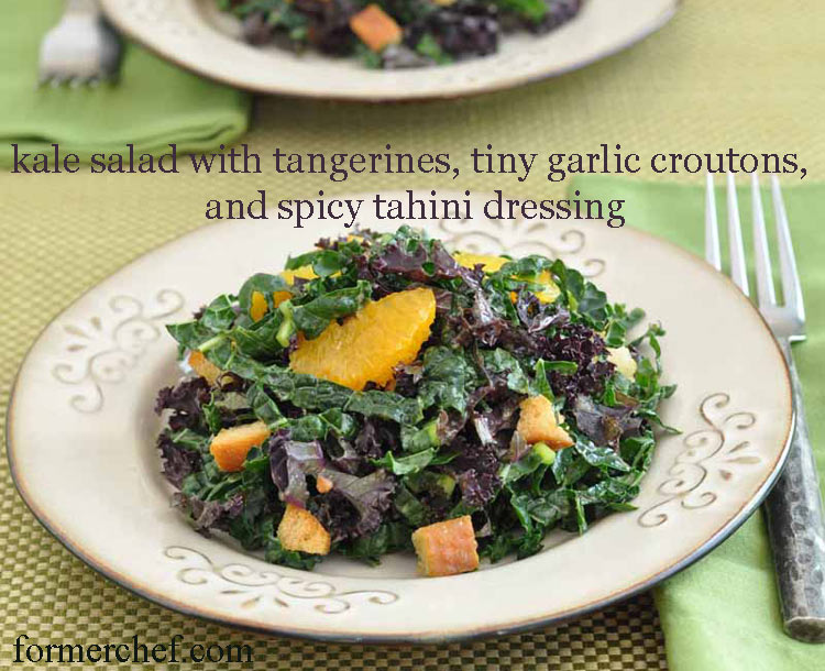 Healthy kale salad with tangerines, tiny garlic croutons, and spicy tahini dressing from www.formerchef.com
